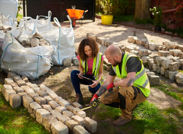 Landscape designer with a contractor at an outdoor construction site in Ogden, UT