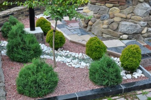 Decorative rocks and shrubs create an attractive, low-maintenance landscape in Ogden, UT