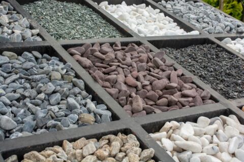 Assorted decorative gravel types are displayed for landscape design projects in Ogden, UT