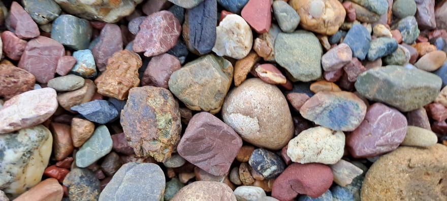 Various landscape rock sizes and colors are displayed for outdoor projects in Ogden, UT